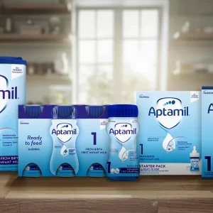 Aptamil First Infant Formula – nutritionally complete milk‑based baby powder in an 800 g canister, with a measuring scoop and a feeding bottle, set against a soft white background with gentle blue accents – the trusted choice for bottle‑fed babies.