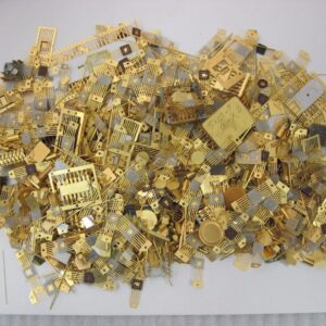 Gold-clad scrap pieces, showing base metal or silver clad with gold, ready for precious metal recovery and recycling.