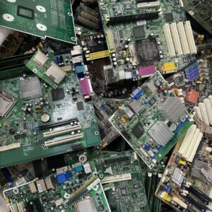 High-grade PCB scrap – assorted green and blue circuit boards from computers and telecom equipment with visible gold-plated connectors and components