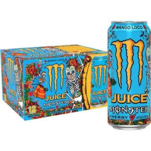 Monster Energy Mango Loco in a vibrant purple and gold Day of the Dead themed can, being poured into a glass with fresh mango slices – tropical mango and real fruit juice energy drink