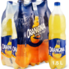 A chilled Orangina glass bottle and a can of the sparkling citrus drink placed alongside fresh oranges and slices, showcasing the visible natural orange pulp.