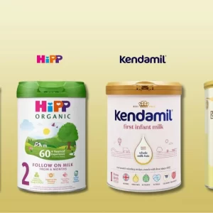 Premium baby formula powder in a 800g canister with a measuring scoop, next to a feeding bottle, fresh milk, and a soft baby blanket – complete infant nutrition for healthy growth.