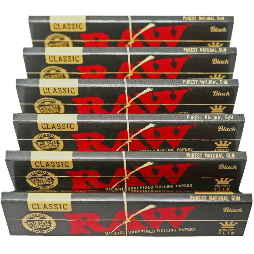 RAW Classic King Size natural unrefined rolling paper booklet – brown unbleached paper with visible CrissCross watermark, RAW logo, and acacia gum line.
