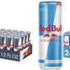 Red Bull Zero Energy Drink in a dark grey and silver can with blue accents, zero‑sugar branding, 250 ml can being poured into a glass with ice cubes, condensation on the can, dynamic motion blur of energy and vitality in the background