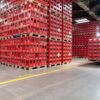 Coca‑Cola Zero Sugar in a red-labeled 12 oz can and a 591 ml bottle, alongside ice cubes, fresh lime wedges, and the iconic Coca‑Cola red and black branding.